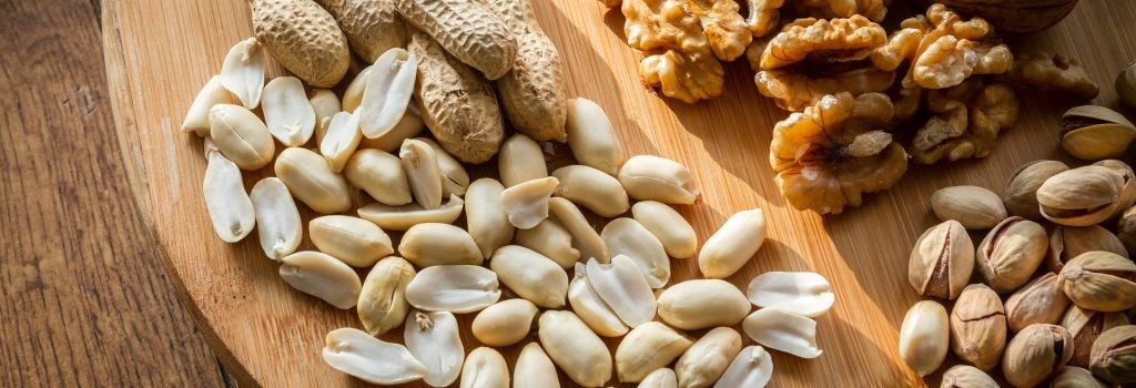 Mixed nuts, including peanuts, waltnuts, almonds, and pistachios