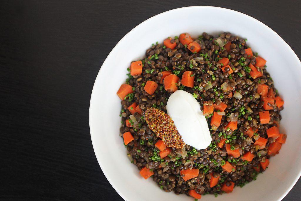 French style lentils cooked with carrots, shallots, olive oil, and topped with whole grain mustard, chives, and some creme fraiche.