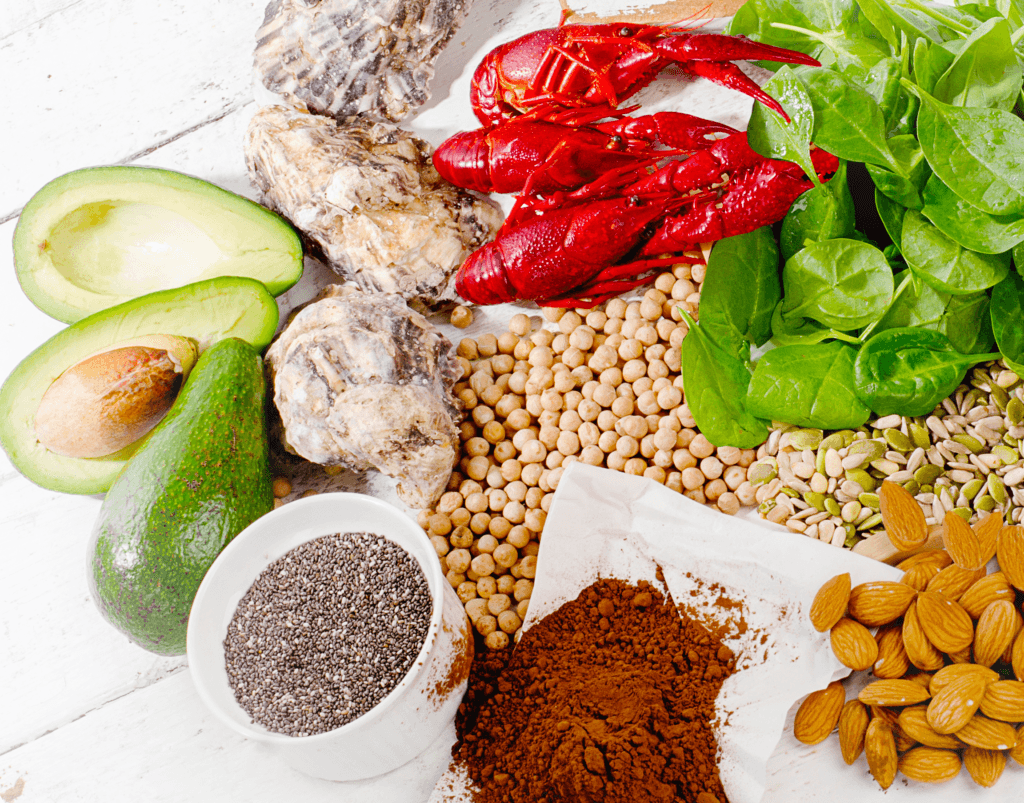 foods rich in the mineral zinc including avocados, oysters, lobster, spinach, beans, almonds, cacao, and chia seeds