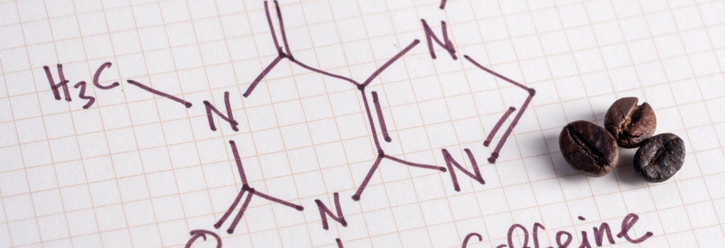 chemical formula for caffeine with three coffee beans on the side