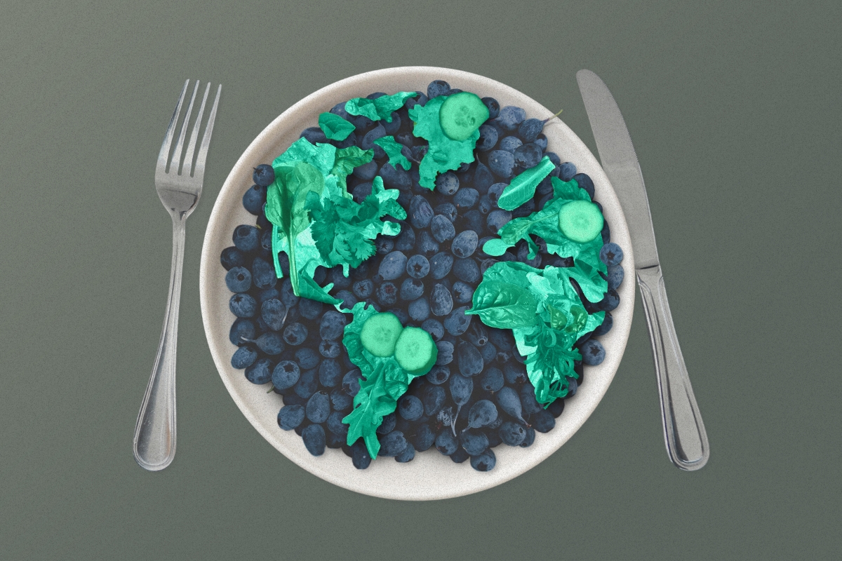 bowl of blueberries and greens in the shape of the planet