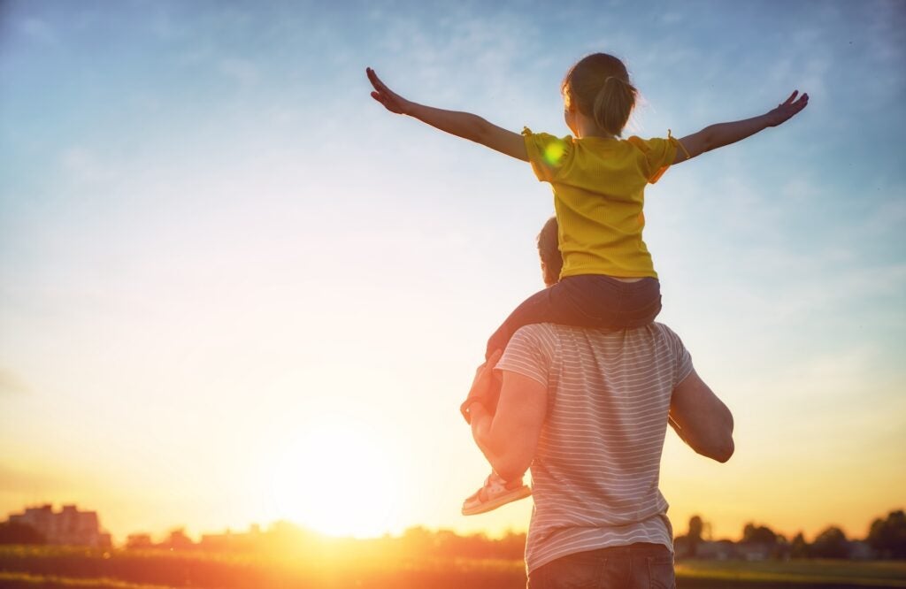 a father and daughter enjoying the sunshine