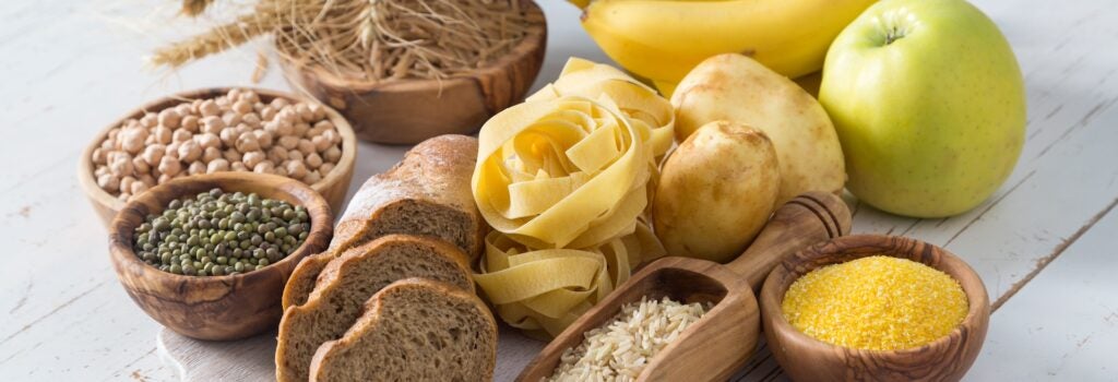 Selection of carbohydrate sources (including grains, pasta, potatoes, bananas and apples)