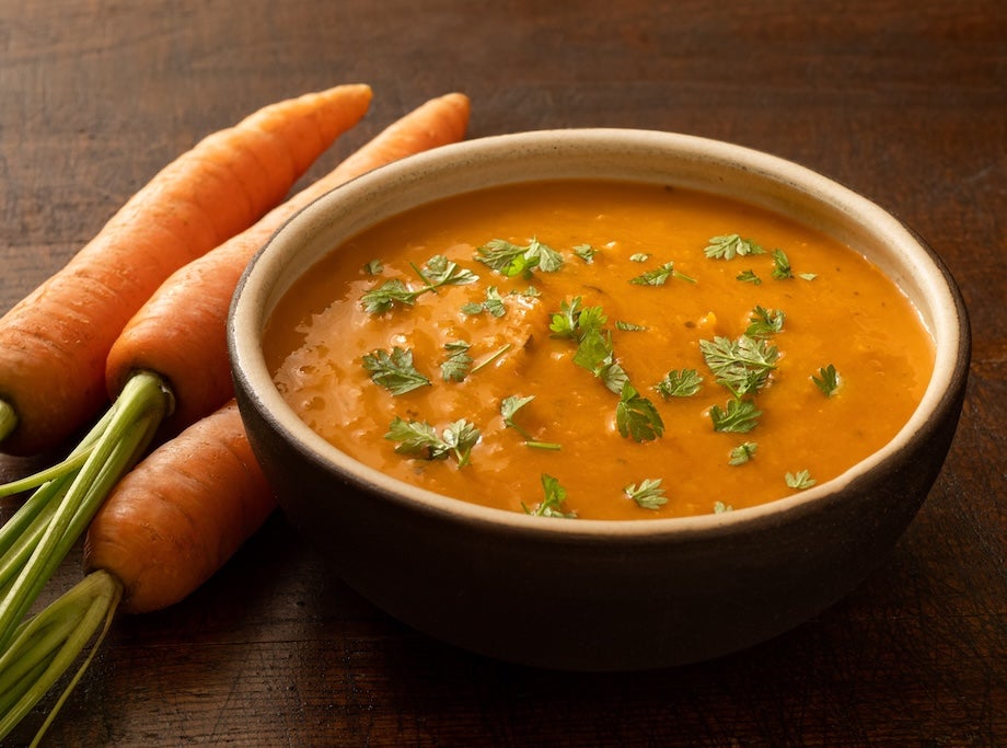 bowl of carrot and coriander soup with carrots